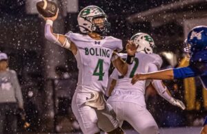 Boling quarterback Jace Urbanek prepares to pass in the rain against Rice Consolidated on October 2, 2026.